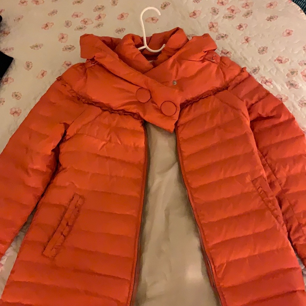 Orange puffer coat